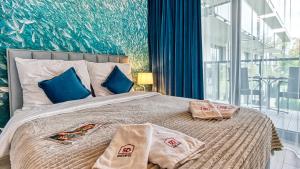 Postel nebo postele na pokoji v ubytování Rezydencja Niechorze 213 - 5D Apartamenty + 19 fotografií