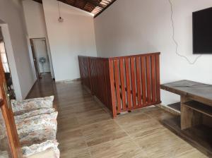 a living room with a couch and a table at Casa Mar Azul in Pitimbu