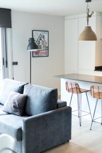 a living room with a couch and a table at Apartamentos Barbara 3 in Alicante