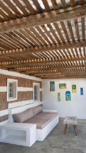 a bed in a room with a wooden ceiling at Cabana da Comporta in Comporta