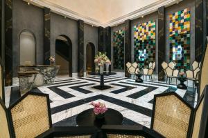 a lobby with a black and white patterned floor at Fairmont Tazi Palace Tangier in Tangier
