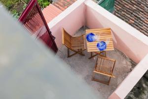 an overhead view of two chairs and a table at WelcomeBuddy - Azorean Ocean House in Ribeira Grande
