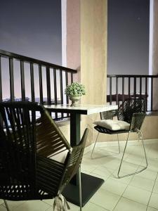 a balcony with a table and chairs on a balcony at Lewish and stylish 1bhk at DSO in Dubai