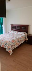 Postel nebo postele na pokoji v ubytování HERMOSO DEPARTAMENTO LA SERENA EXCELENTE UBICACIÓN