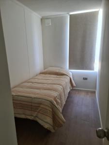 Postel nebo postele na pokoji v ubytování HERMOSO DEPARTAMENTO LA SERENA EXCELENTE UBICACIÓN
