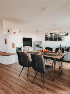 a dining room with a table and chairs at Dorf 70 in Eichenberg