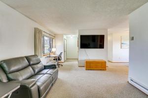 a living room with a couch and a table at Downtown Delta Condo about 34 Mi to Black Canyon! in Delta
