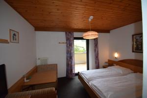 Postel nebo postele na pokoji v ubytování Hotel Montana