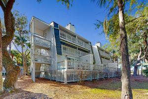 a building with balconies on the side of it at Driftwood Villa - 267 in Edisto Island