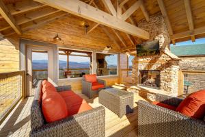 a large living room with a fireplace in a house at Delta Dawn Retreat in Sevierville