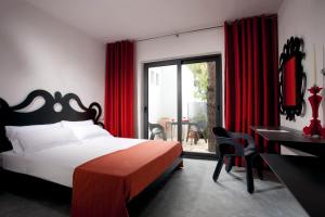 En eller flere senger på et rom på Meditur Puglia by Itafirst Hotels