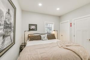 a bedroom with a bed and a picture on the wall at Bright and Modern Home 2 Mi to Presque Isle Airport in Presque Isle