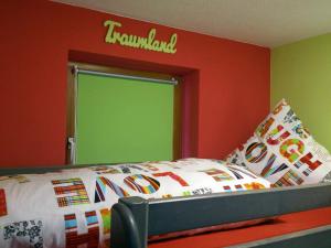 a bedroom with a bed with a sign on the wall at BIENE`S Ferientraum in Reit im Winkl