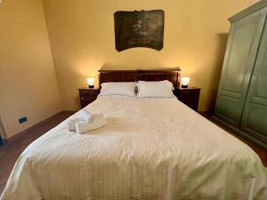 Posteľ alebo postele v izbe v ubytovaní Le Serre Suites & Apartments