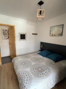 a bedroom with a large bed in a room at Le Roc in Saint-Jean-d'Aulps