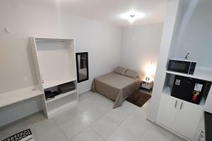 Postel nebo postele na pokoji v ubytování Xavi Studio - Proximo ao Boulevard Shopping, Av Nacoes Unidas e Nuno de Assis.