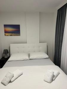 Postelja oz. postelje v sobi nastanitve Grand Lux Apartmani Pale