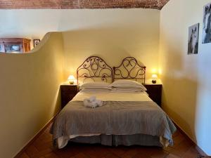 Posteľ alebo postele v izbe v ubytovaní Le Serre Suites & Apartments