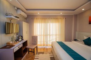 Uma cama ou camas num quarto em Majheri Resort and Spa