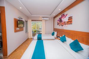 Uma cama ou camas num quarto em Majheri Resort and Spa