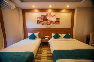 Uma cama ou camas num quarto em Majheri Resort and Spa