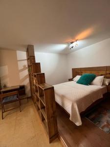 a bedroom with a large bed with a ladder at Lomas de las Mercedes in Caracas
