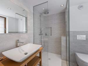 a bathroom with a white sink and a shower at Chalet Méribel, 7 pièces, 12 personnes - FR-1-565-1 in Les Allues