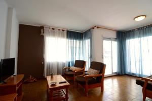 Televízia a/alebo spoločenská miestnosť v ubytovaní Puig Sureda - apartamentos