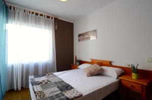 Posteľ alebo postele v izbe v ubytovaní Puig Sureda - apartamentos