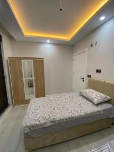 Ένα ή περισσότερα κρεβάτια σε δωμάτιο στο 1+1 Luxury Suite Room