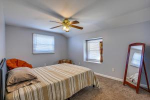a bedroom with a bed and a ceiling fan at Maryland Abode with Patio Near Baltimore Harbor in Baltimore