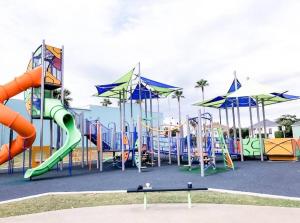 a playground with a slide and an inflatable at Nautical Retreat (Unit 5) in Galveston