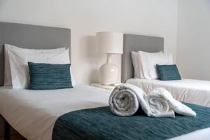 Кровать или кровати в номере WelcomeBuddy - Azorean Flats II (City Center)