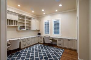 a kitchen with white cabinets and a blue rug at Gimlet Family Home Close to Lift with Hot Tub! in Hailey +48 photos