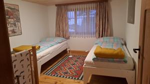 Postel nebo postele na pokoji v ubytování Haus Dani Danis