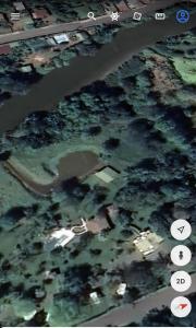 an aerial view of an island in the water at hotelsonidosamados-osa in Sierpe