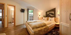 A bed or beds in a room at B&B Appartments Cudlea