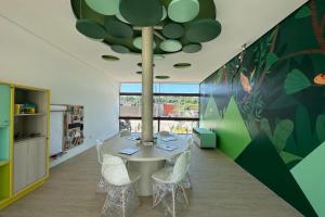 a dining room with a table and chairs at Studio de Luxo em Muro Alto - Makia Beach A209 in Porto De Galinhas