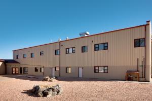 a large building with a lot of windows at Downtown Del Norte Apartment Ski, Hike and Shop! in Del Norte