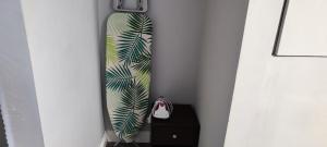 a surfboard leaning against a wall in a room at A Whole Townhouse to you in Distington