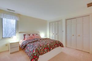 a white bedroom with a bed and a window at Fort Wayne Vacation Rental about 9 Mi to Downtown! in Ellison