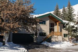 a house with a garage in the snow at Ski Way Home Steps to the Warm Springs Lift in Ketchum