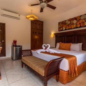 En eller flere senge i et værelse på Hotel Las Golondrinas