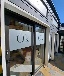 a store door with the words ok on it at Okeyloft Coyhaique 4 in Coihaique