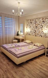 a bedroom with a large bed in a room at Veles Apartment in Prague