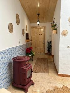 a living room with a wood stove in a room at Casa luliche in Las Palmas de Gran Canaria