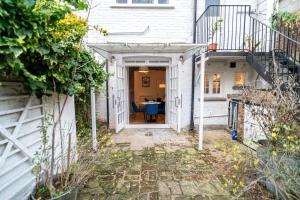 an entrance to a house with an open door at One-bed flat Angel, Islington in London