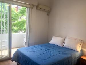 En eller flere senge i et værelse på Artistes du Monde