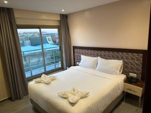 En eller flere senger på et rom på Oceana Mazagan Suites Hotel