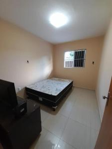 Ένα ή περισσότερα κρεβάτια σε δωμάτιο στο Apartamento de temporada perto do Parque Euclides Dourado